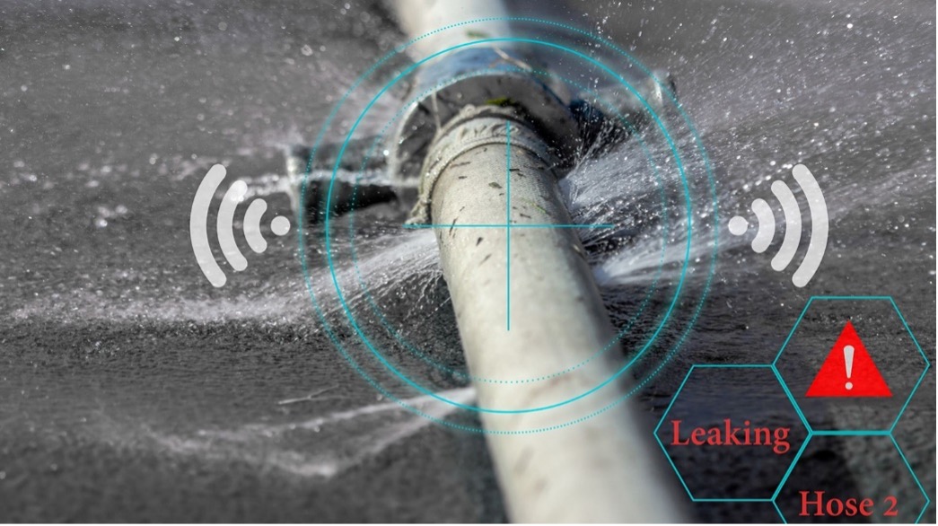 Close-up image of a leaking hose with visual effects indicating real-time leak detection technology, showcasing signals and a warning icon labeled “Leaking Hose 2.”